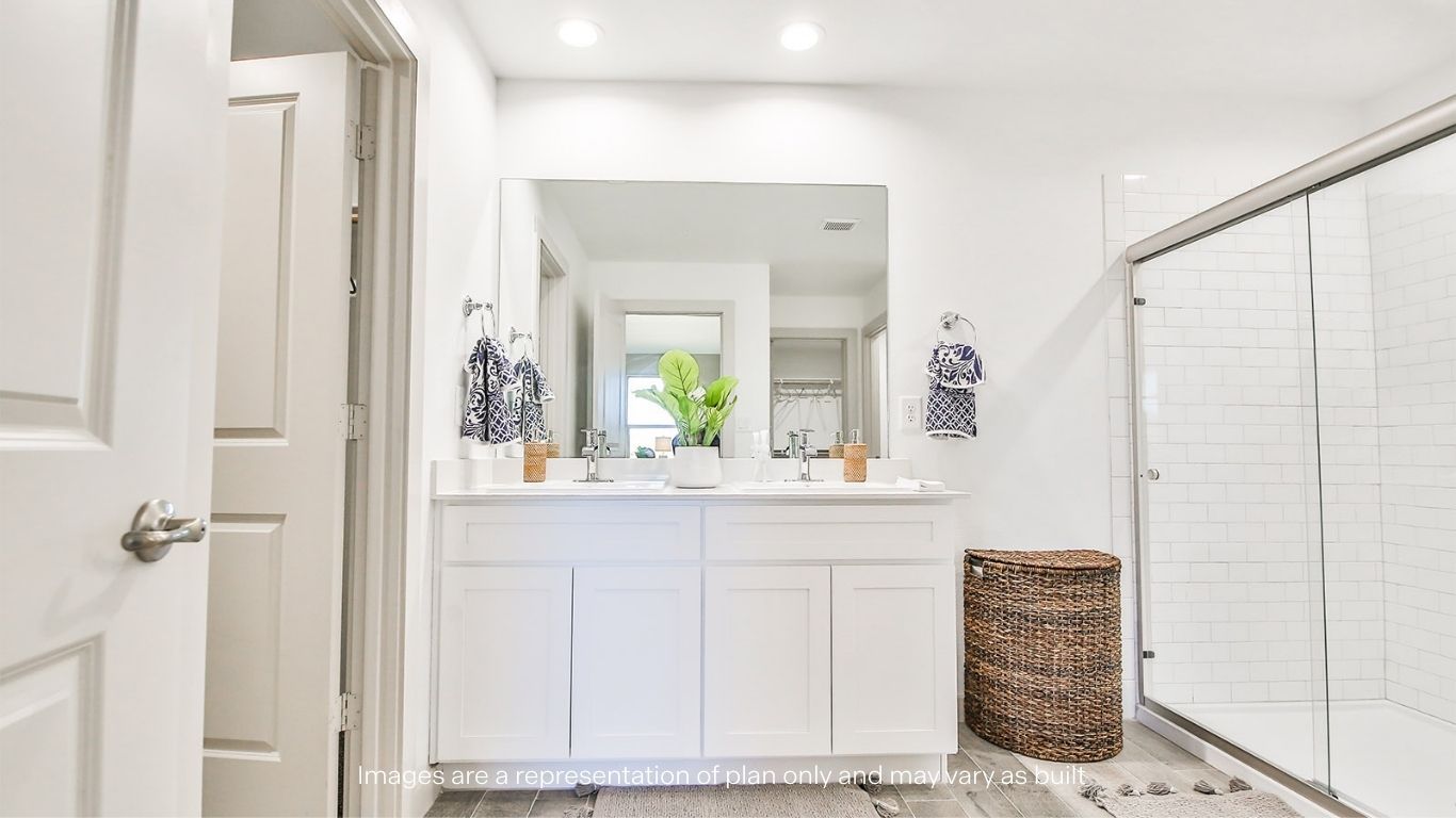 Private attached primary bathroom with built in vanity