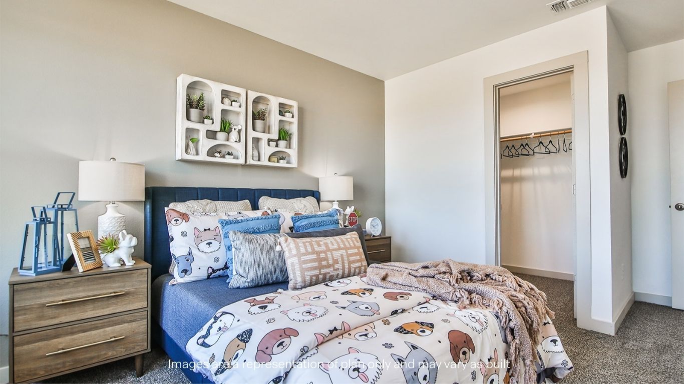 Guest bedroom 2 with plush carpet flooring and spacious closet