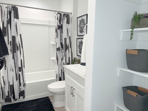 Guest bathroom with single sink and vanity