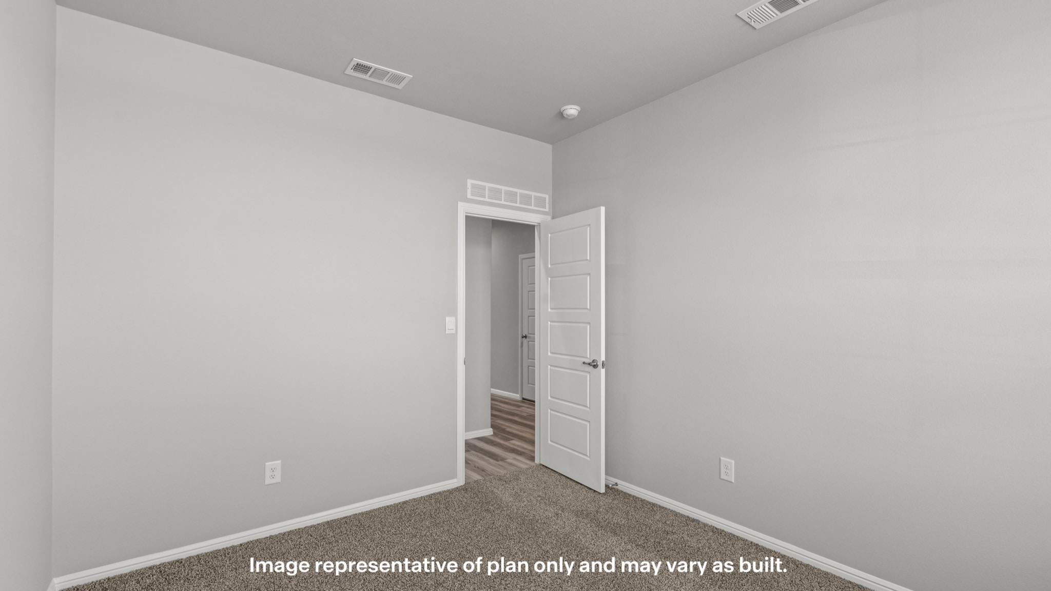 Guest bedroom 1 with plush carpet floors and spacious closet