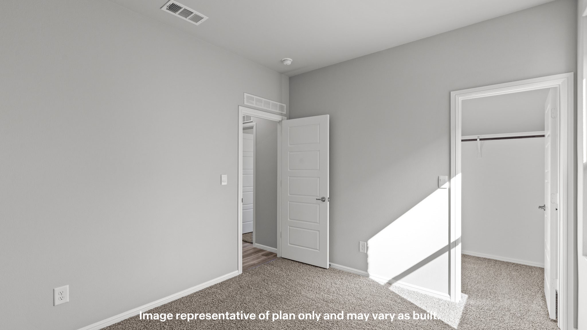 Guest bedroom 2 with plush carpet floors and spacious closet