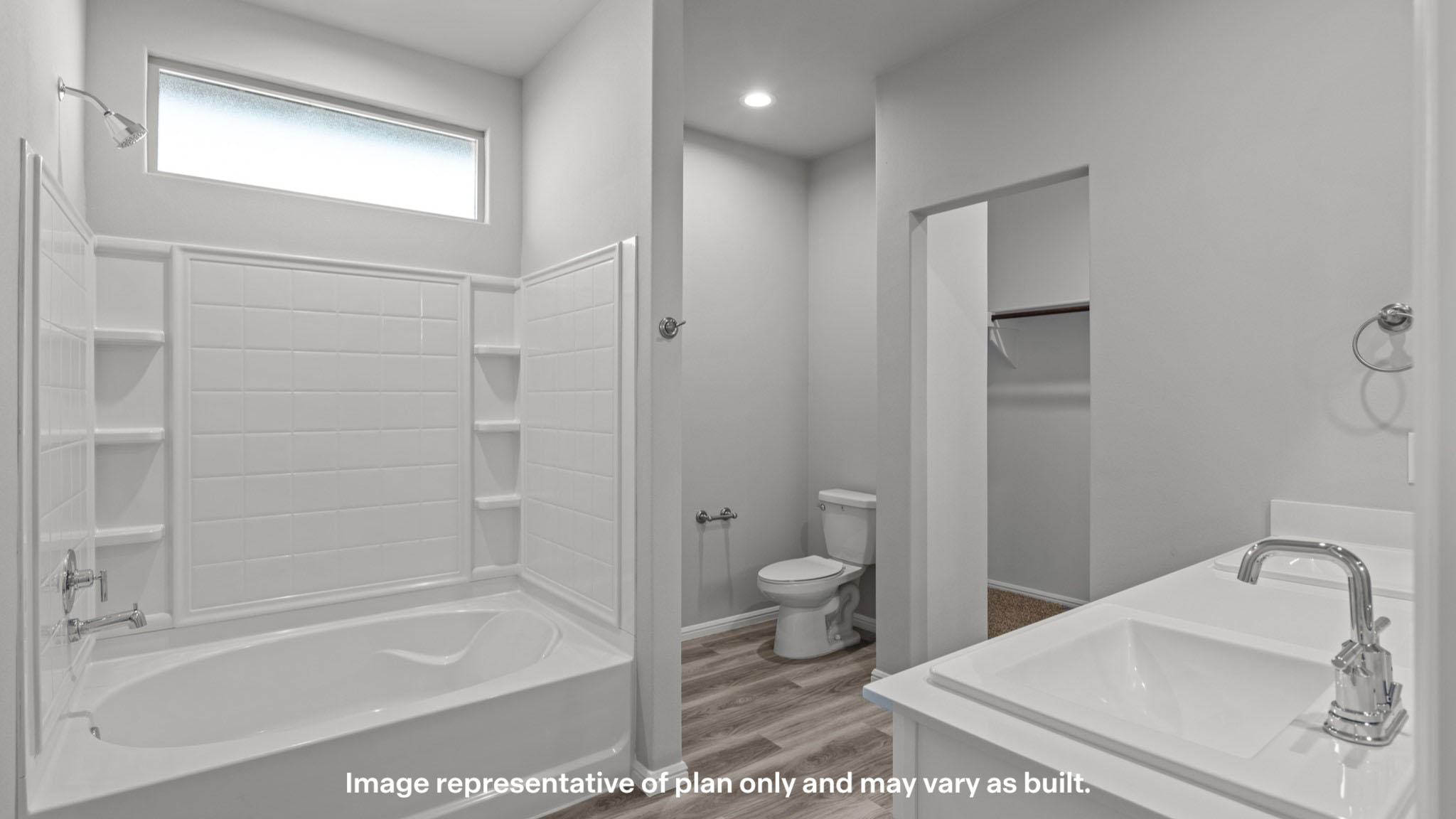 Private attached primary bathroom with built in vanity and luxurious shower