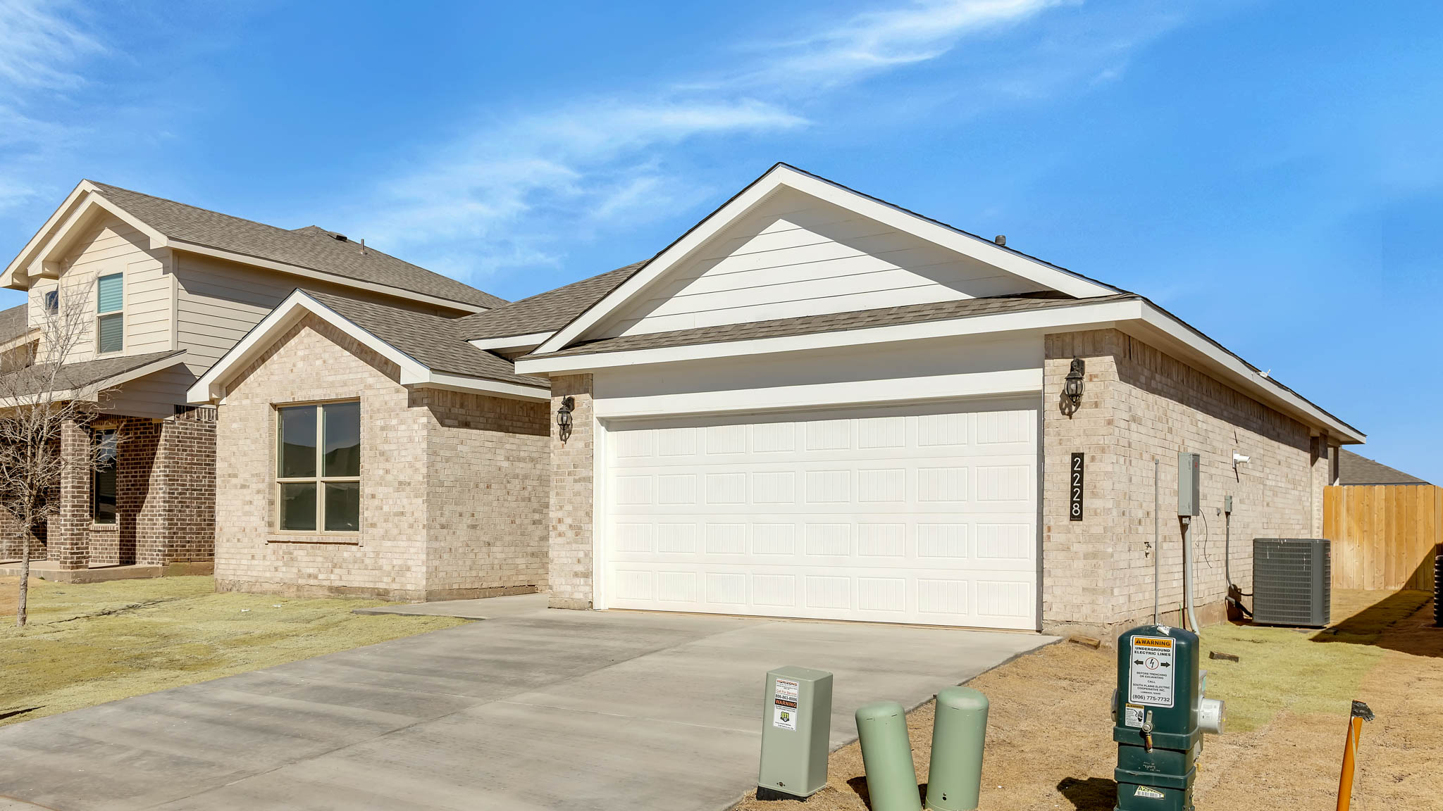 Side view of single story timeless brick home