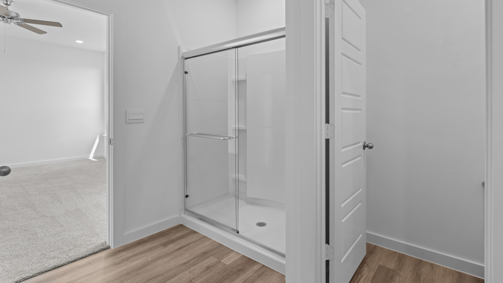Primary bathroom with luxurious shower and built in storage