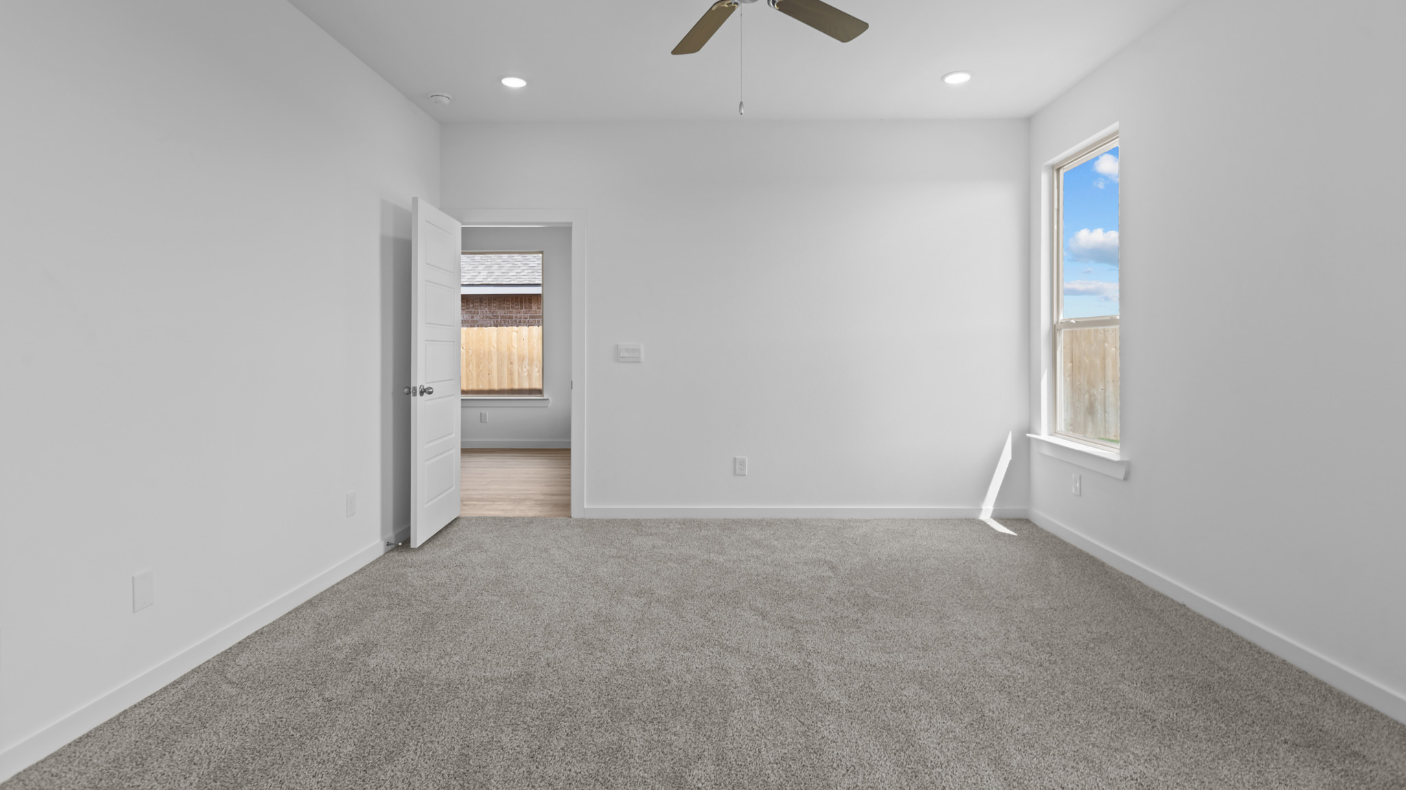 Primary bedroom with private attached bathroom and walk-in closet