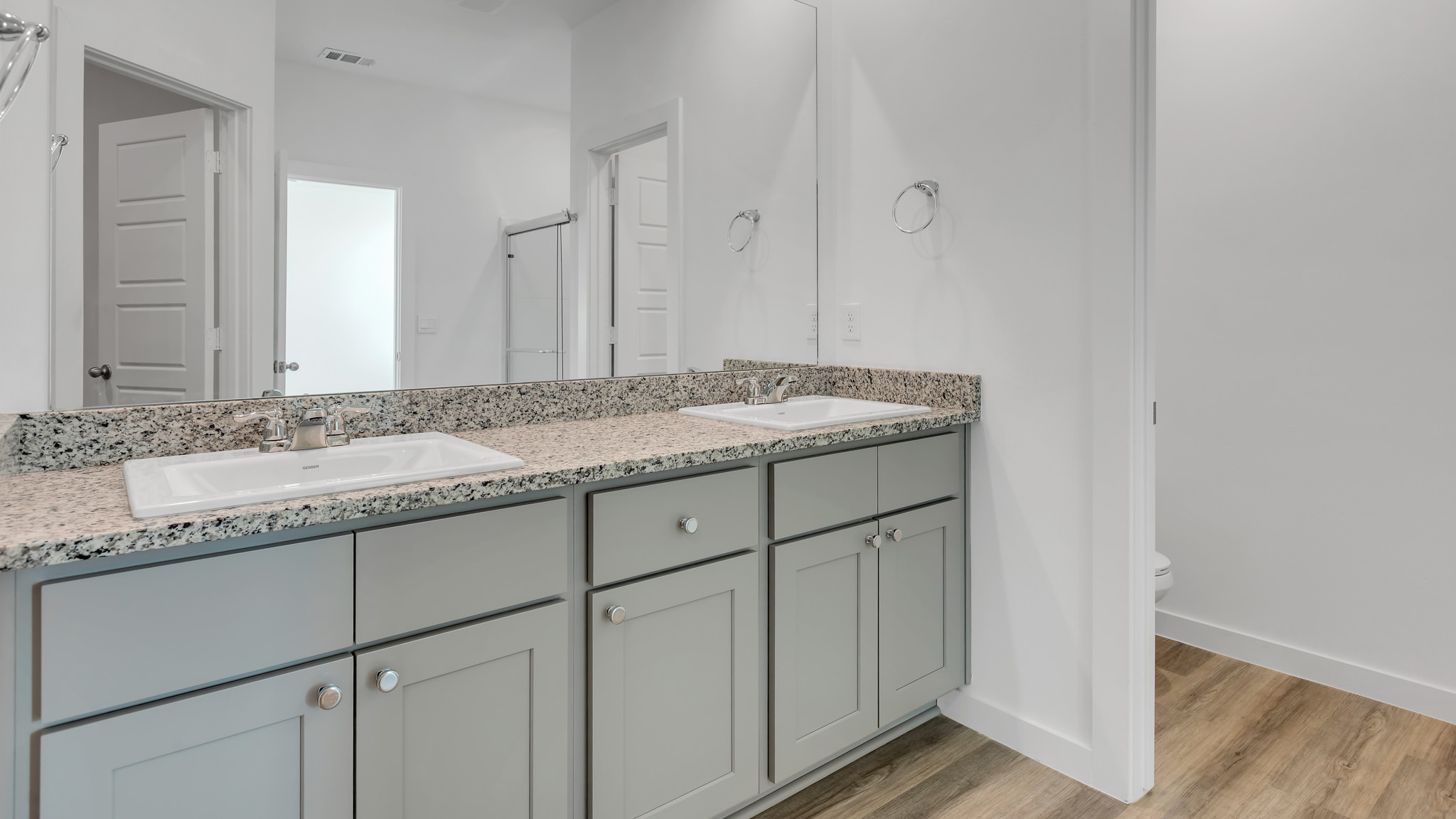 Primary bathroom with built in double sink vanity