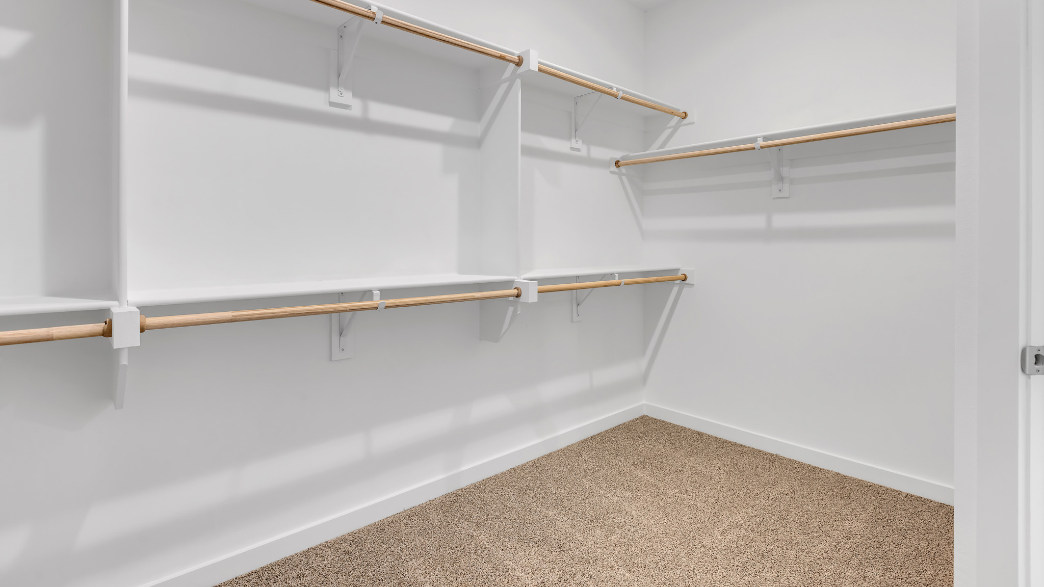 Primary room walk in closet with extra storage space