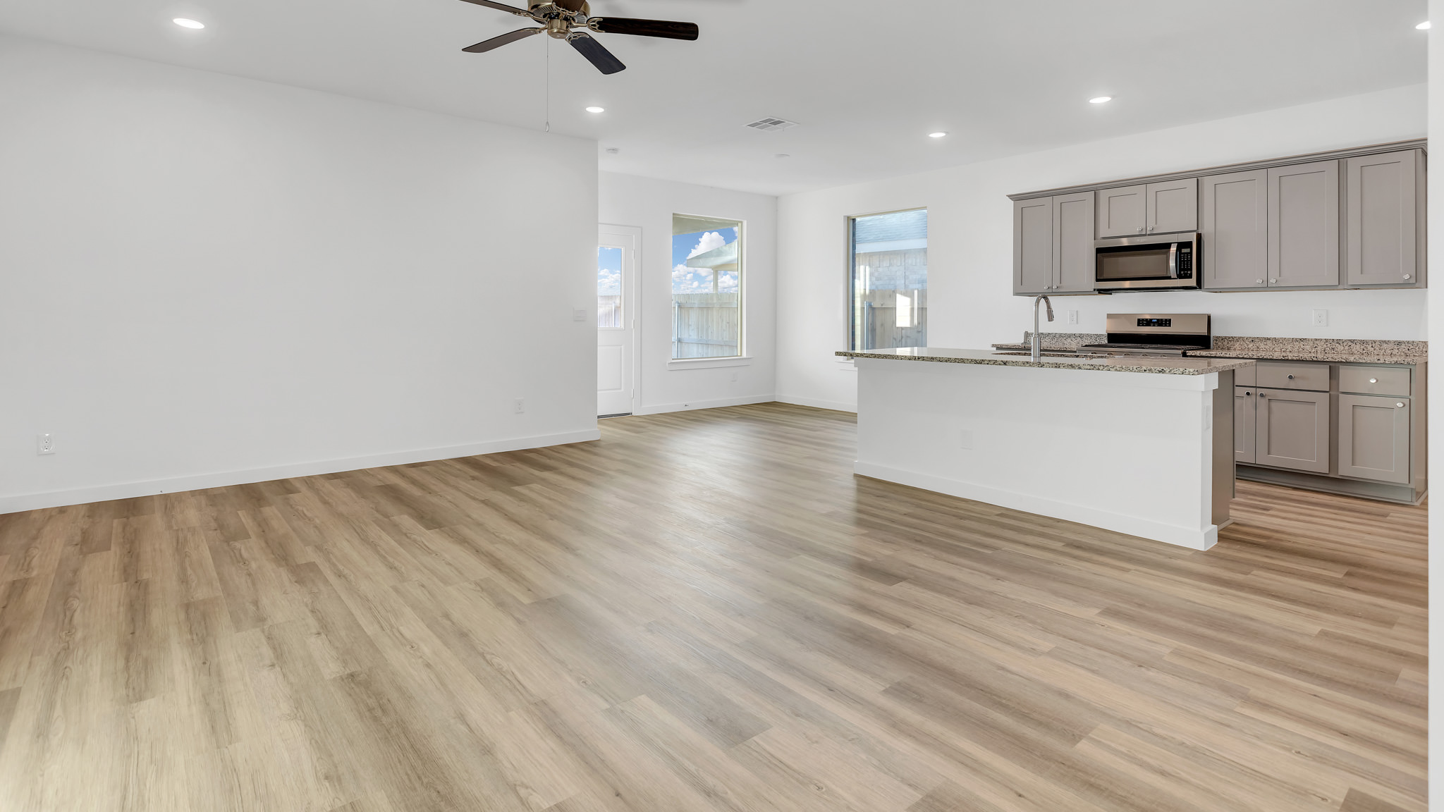 Open concept living, kitchen, and dinning area