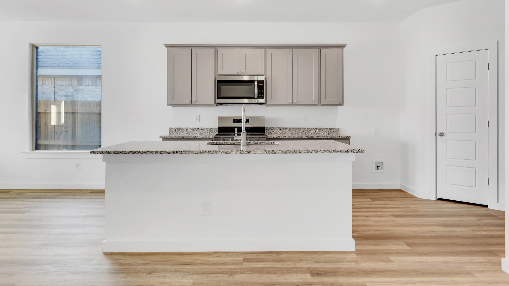 Open concept kitchen with ample lighting