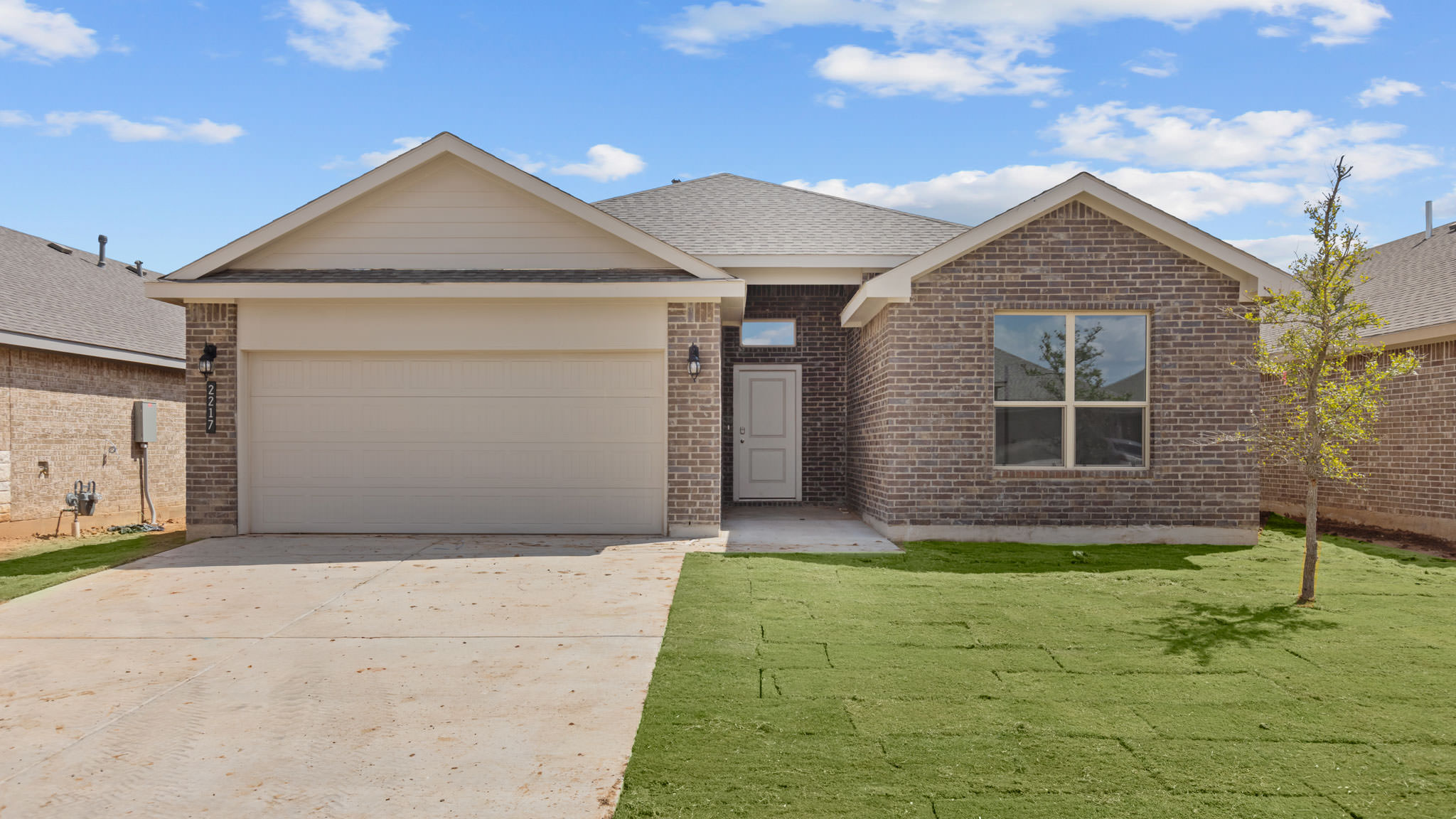 Exterior of single story modern brick style home