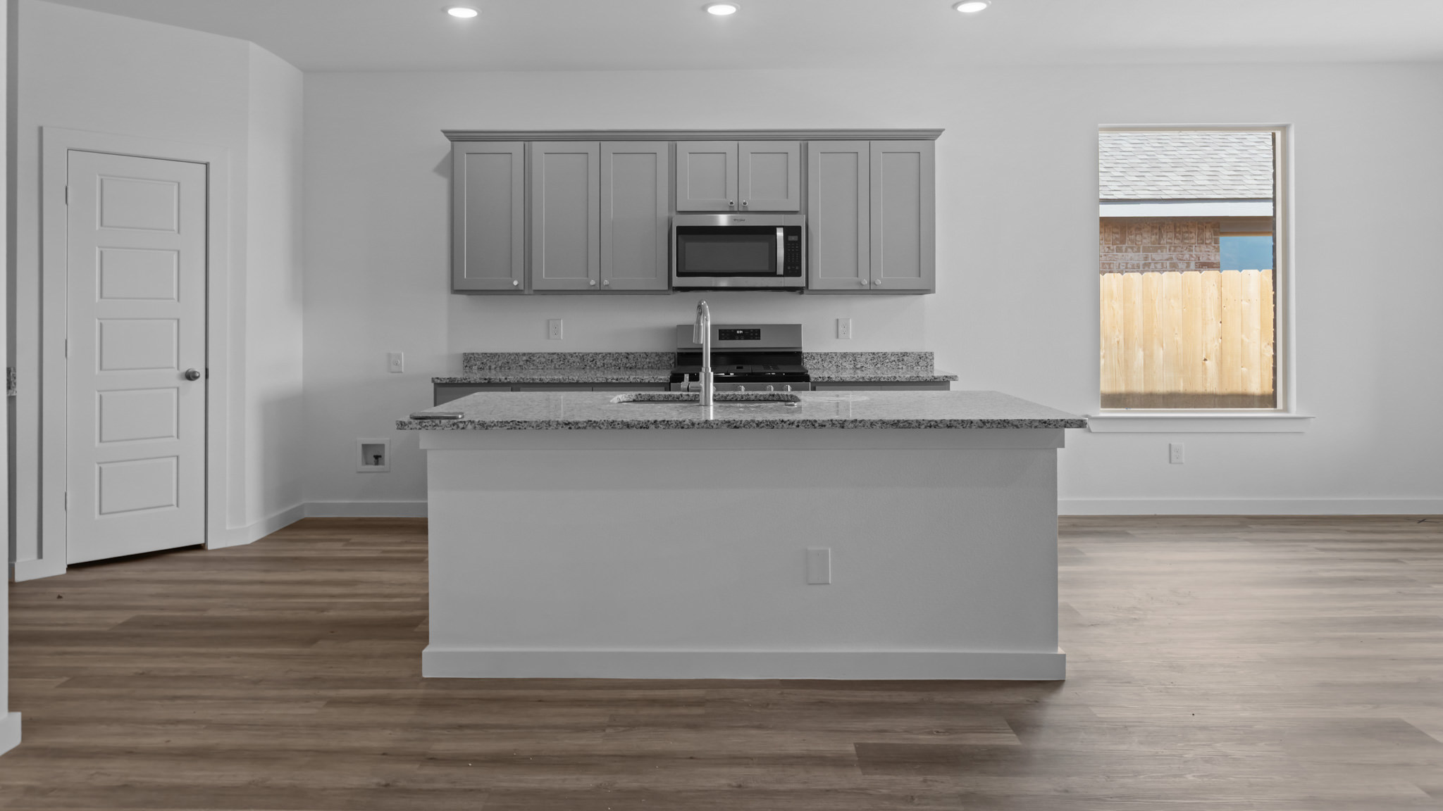 Spacious open concept kitchen with island and counter prep space