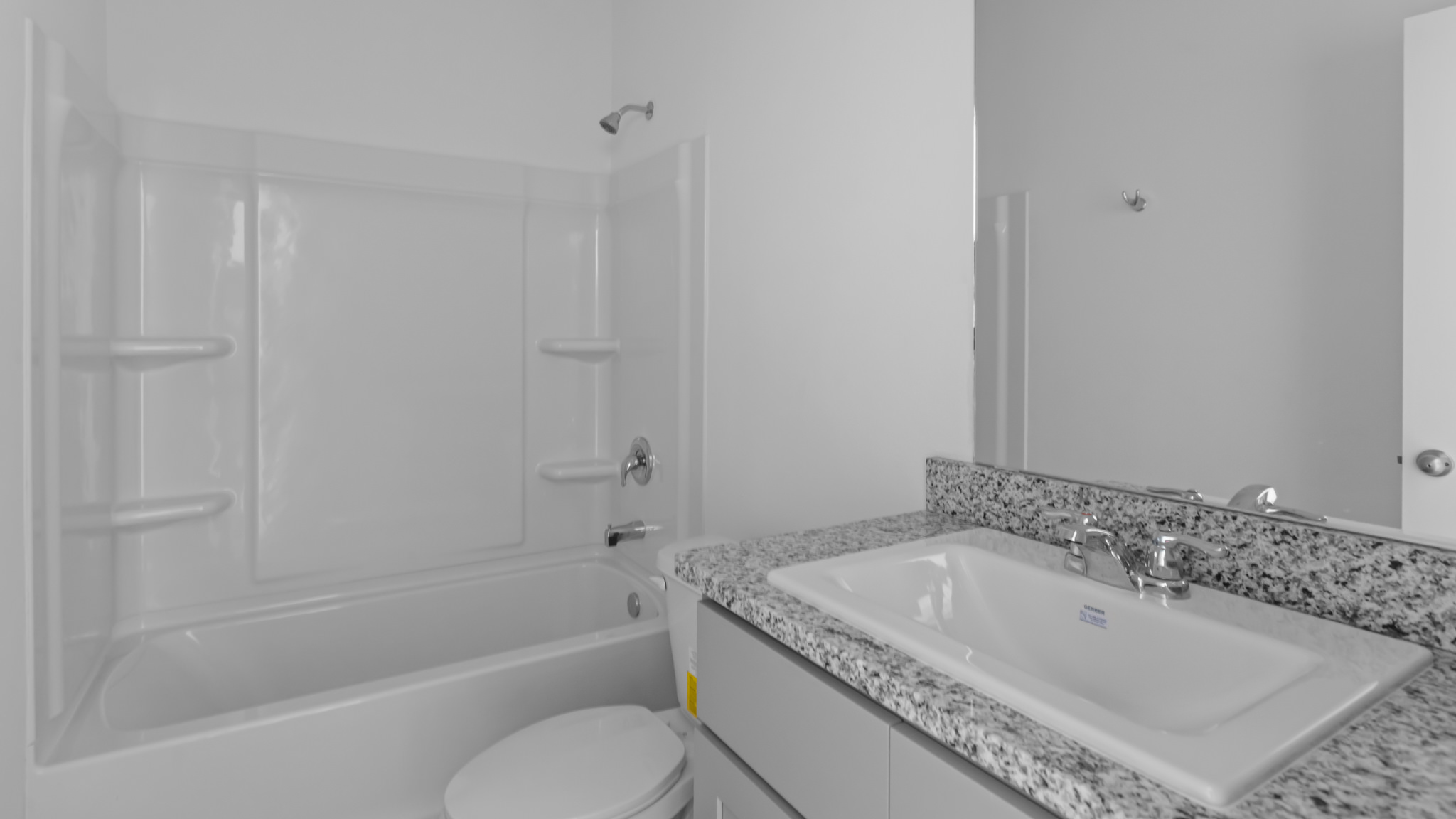 Guest bathroom with built in vanity and combination bathtub shower