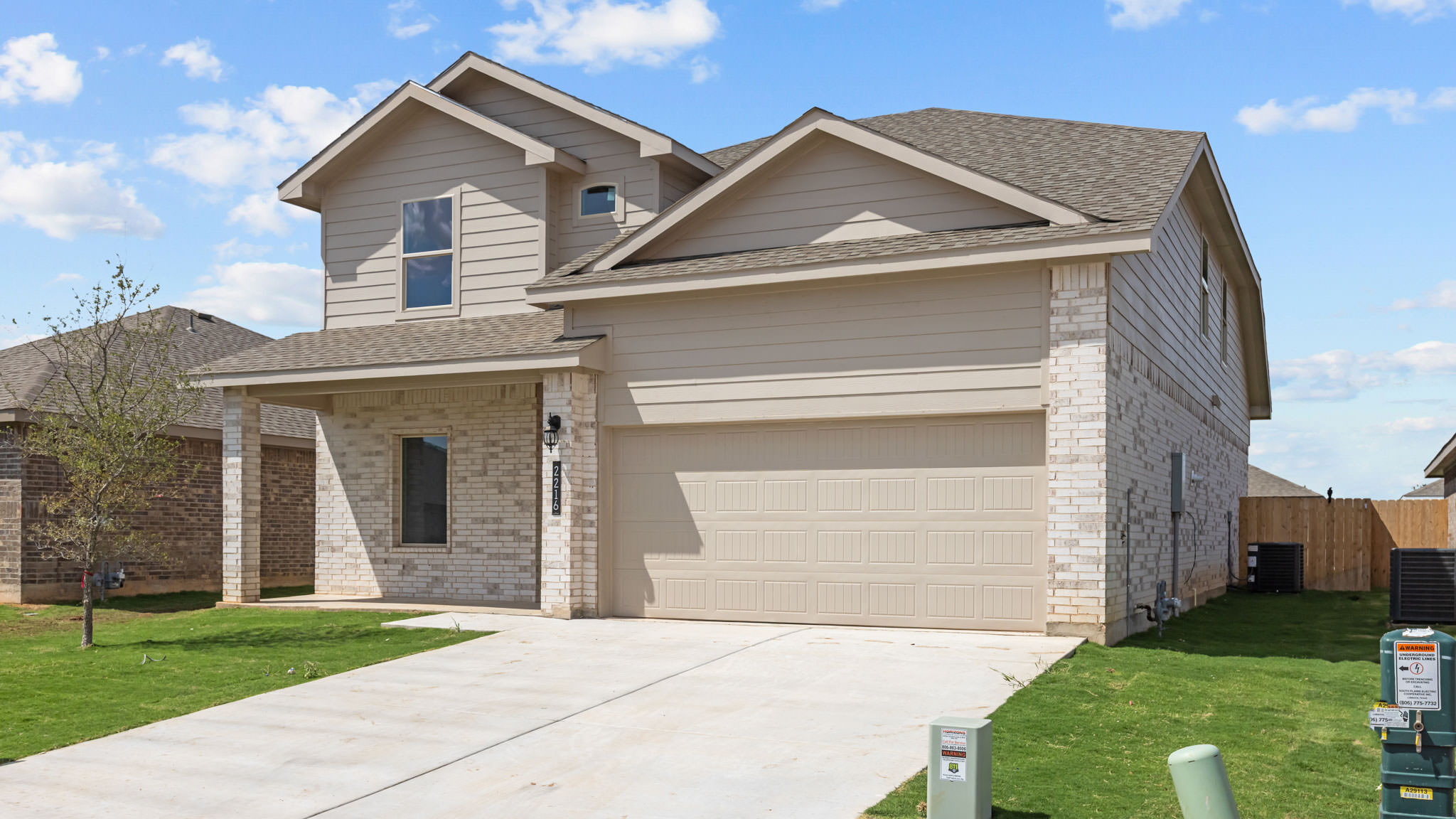 Side view of two story classic brick home
