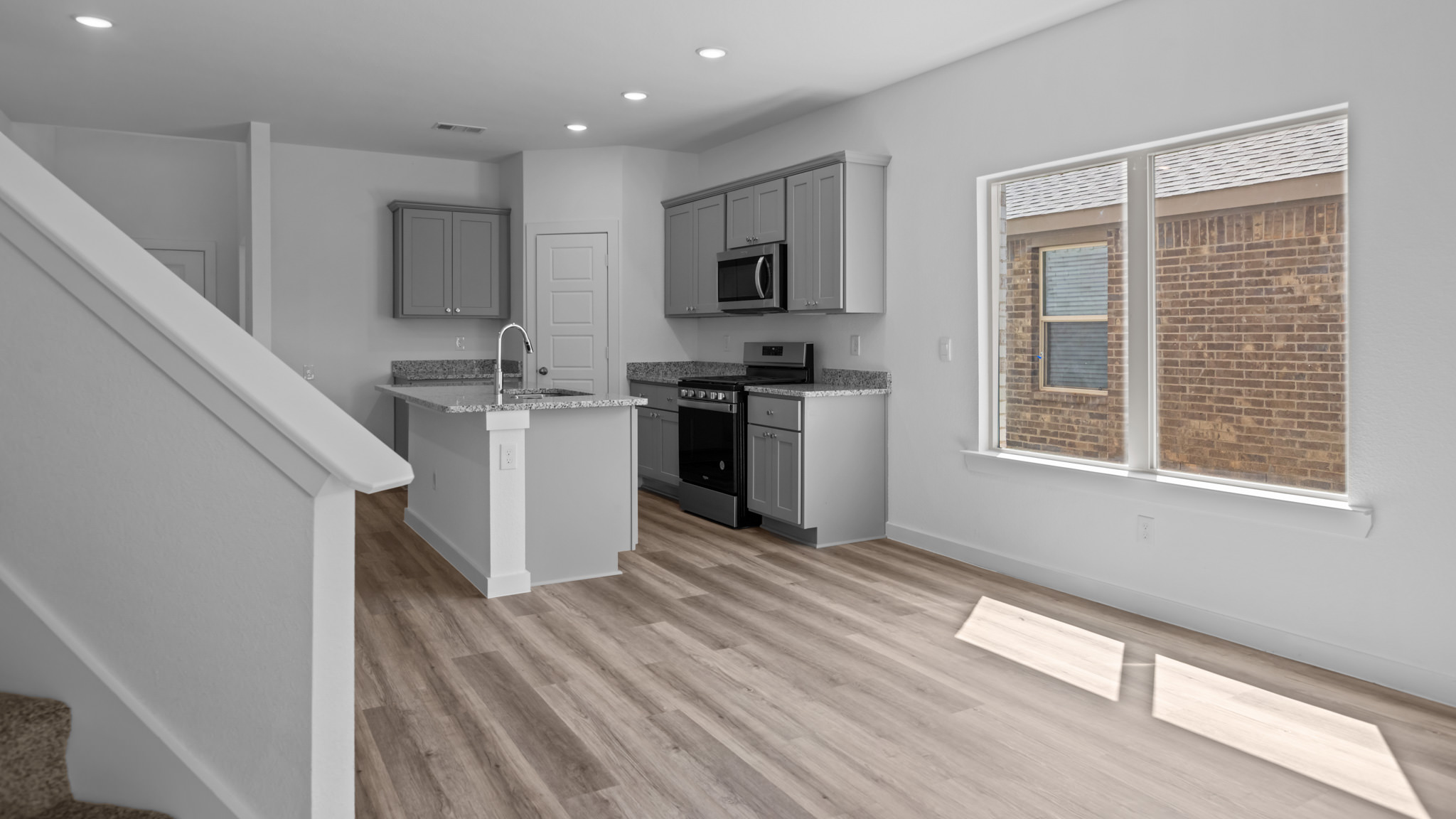 Spacious open kitchen overlooking family and living space