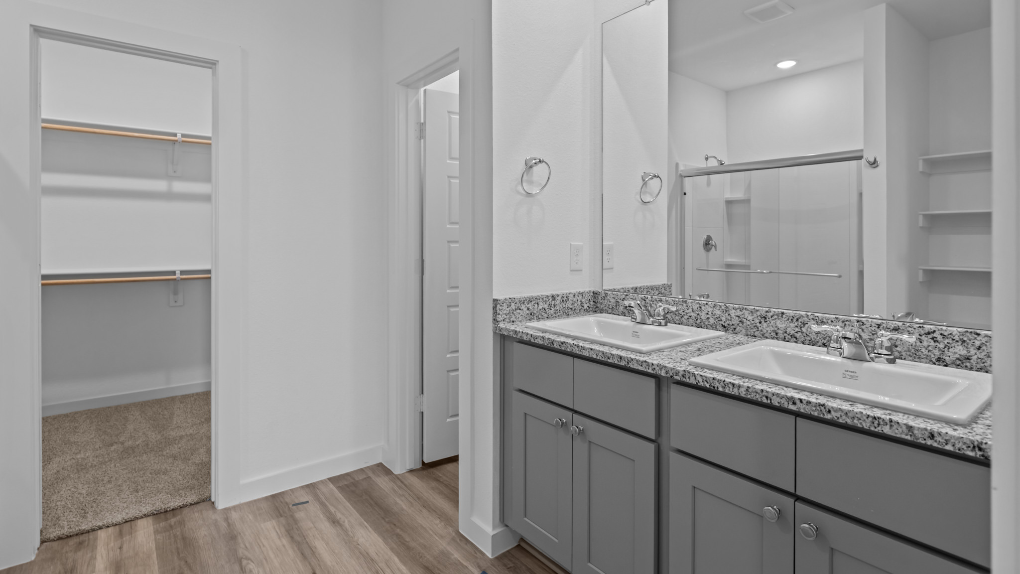 Private attached primary bathroom with built in vanity