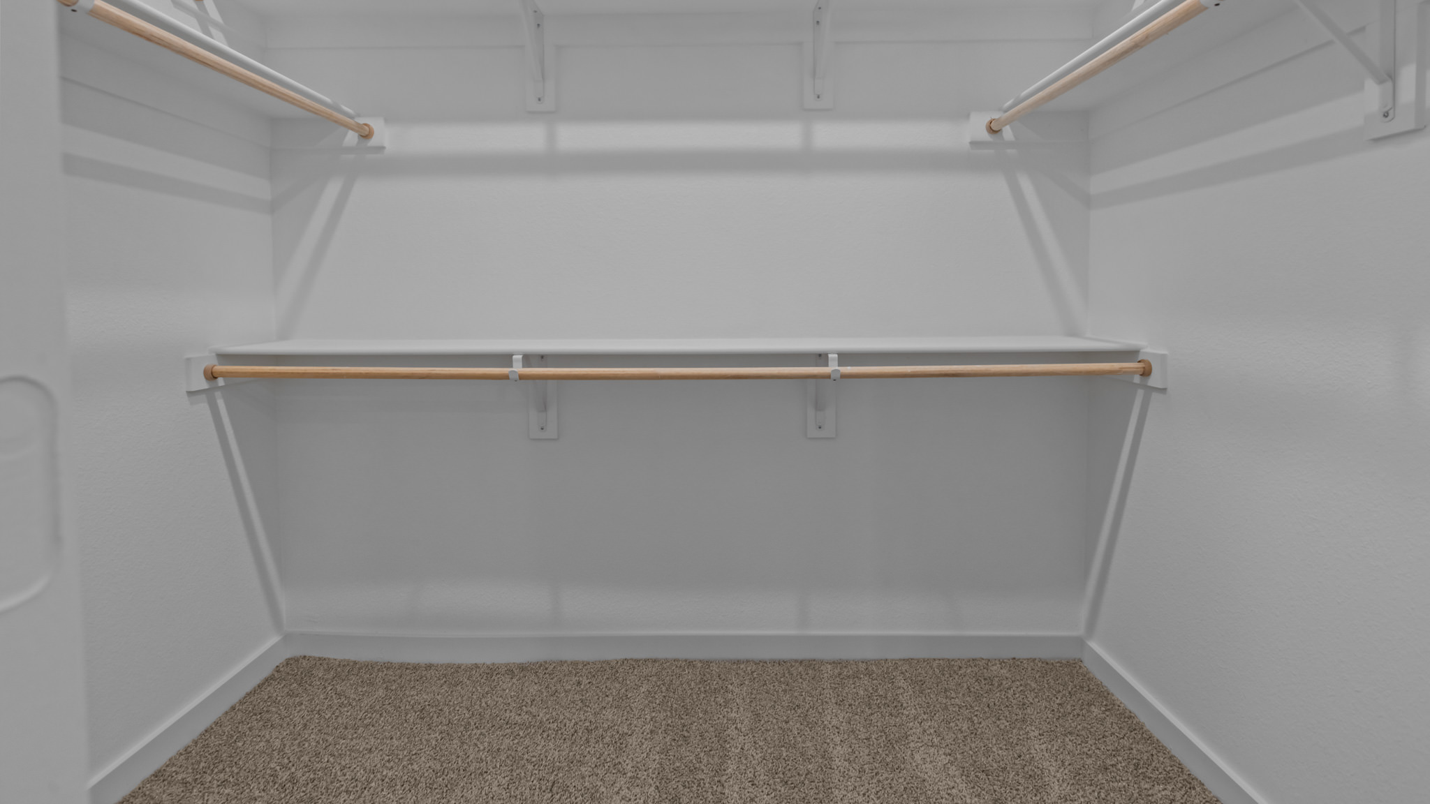 Private primary walk-in closet with extra storage space