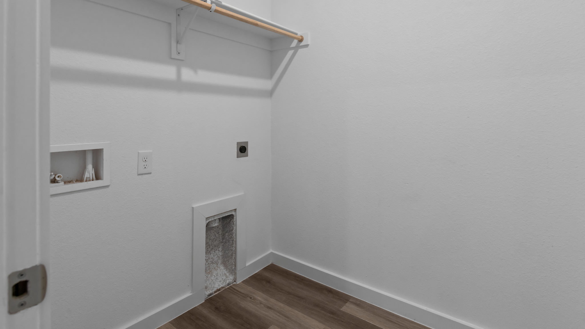 Laundry room and utility closet space with extra storage