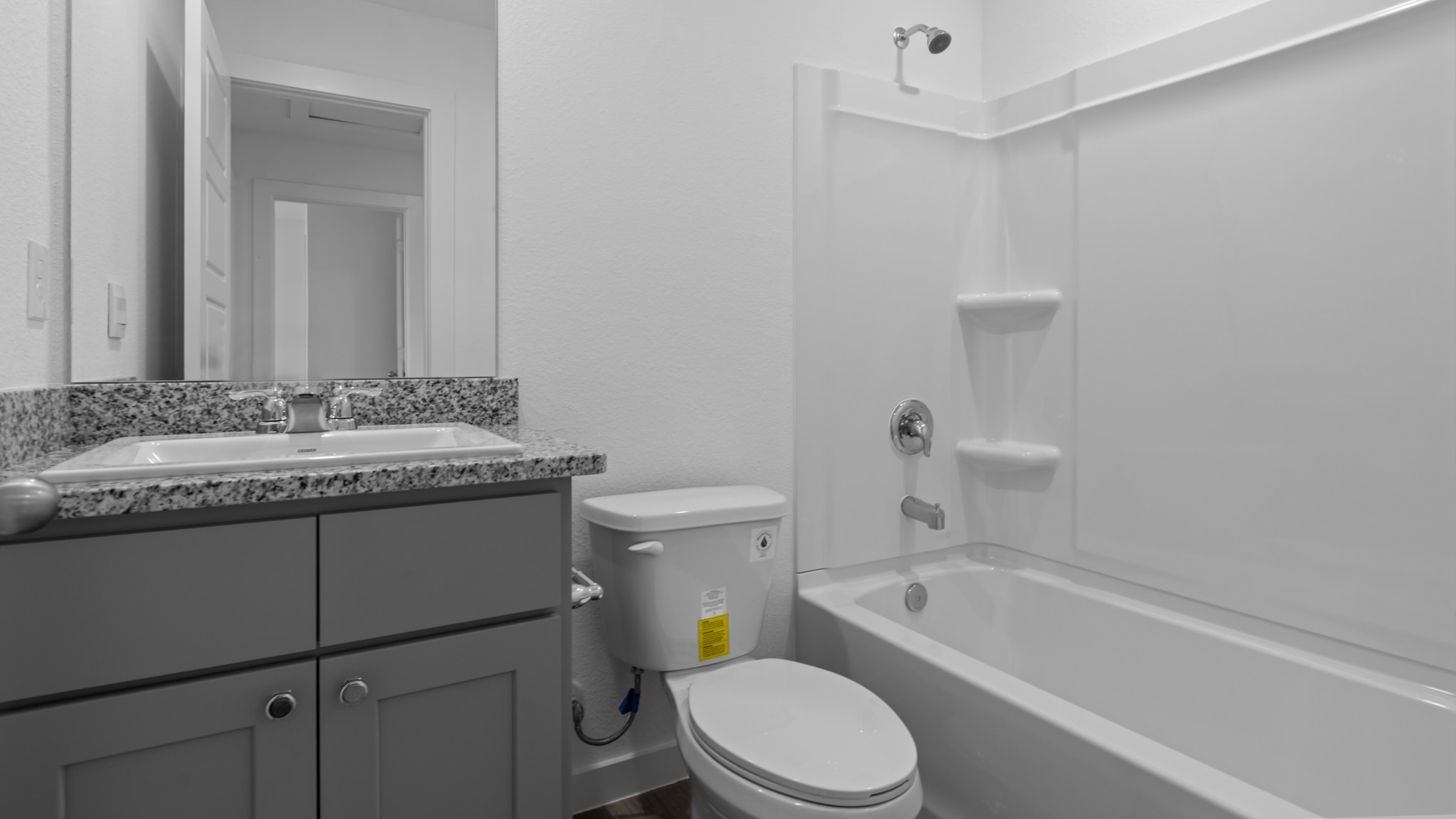 Upstairs guest bathroom with combination shower and bathtub