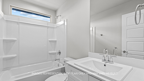 guest bathroom with single sink, vanity, and bathtub shower combo