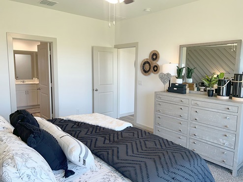 Primary bedroom with attached bathroom