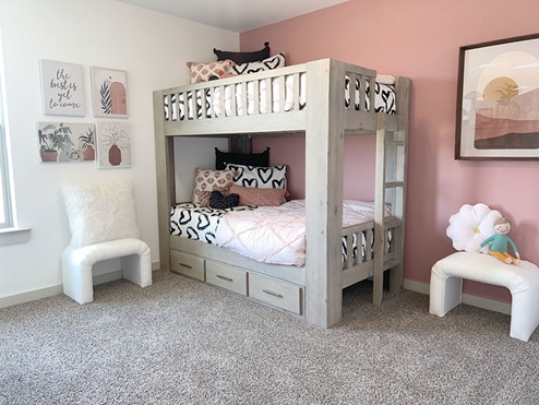 Guest bedroom with plush carpet and bunk bed
