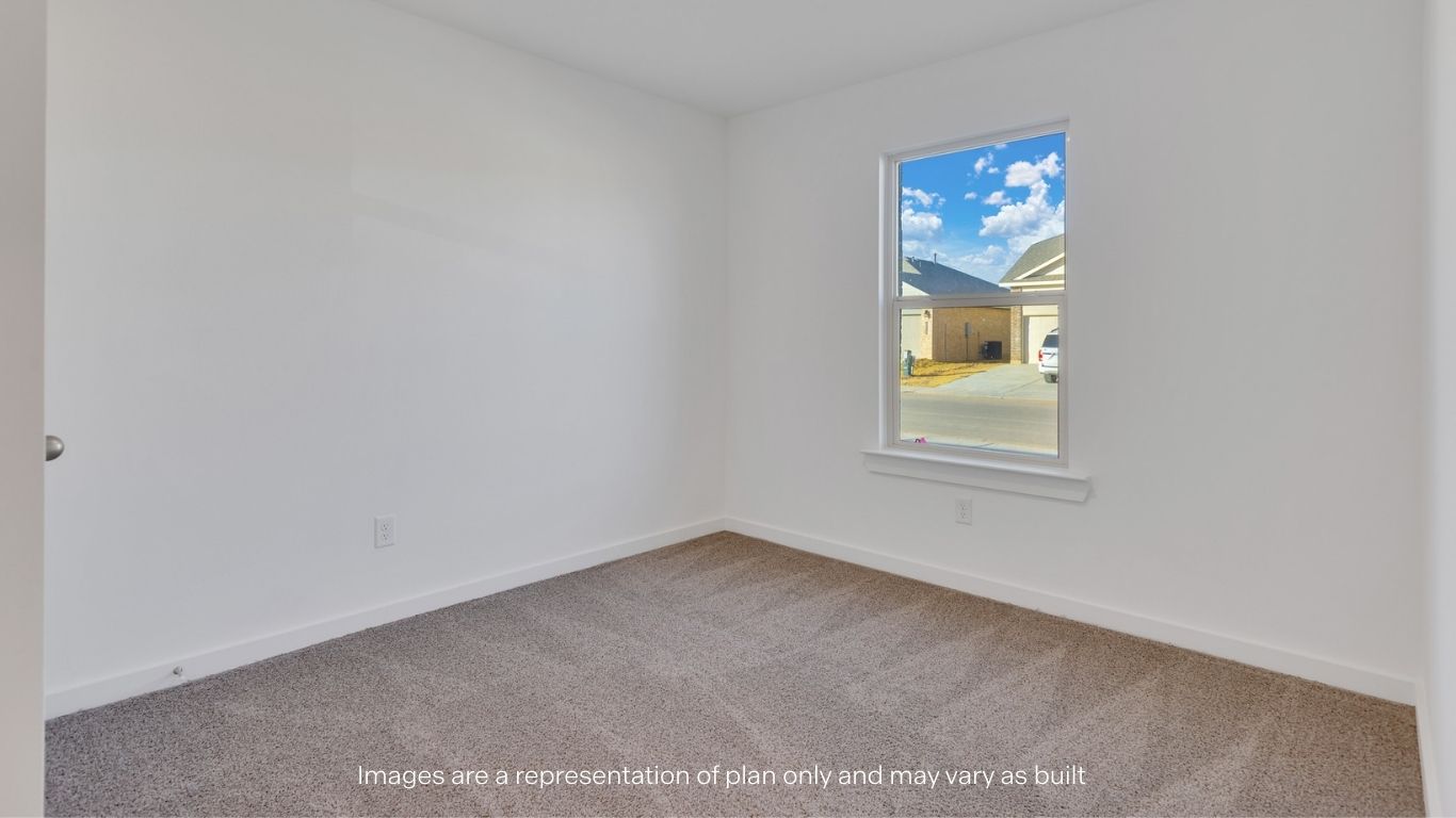 Guest bedroom 1 with front windows and ample natural light