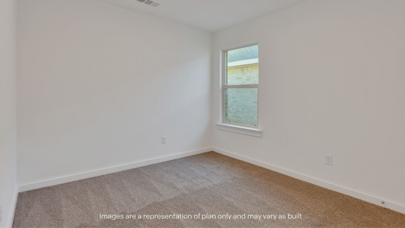 Guest bedroom 2 with side window and plush carpet floor