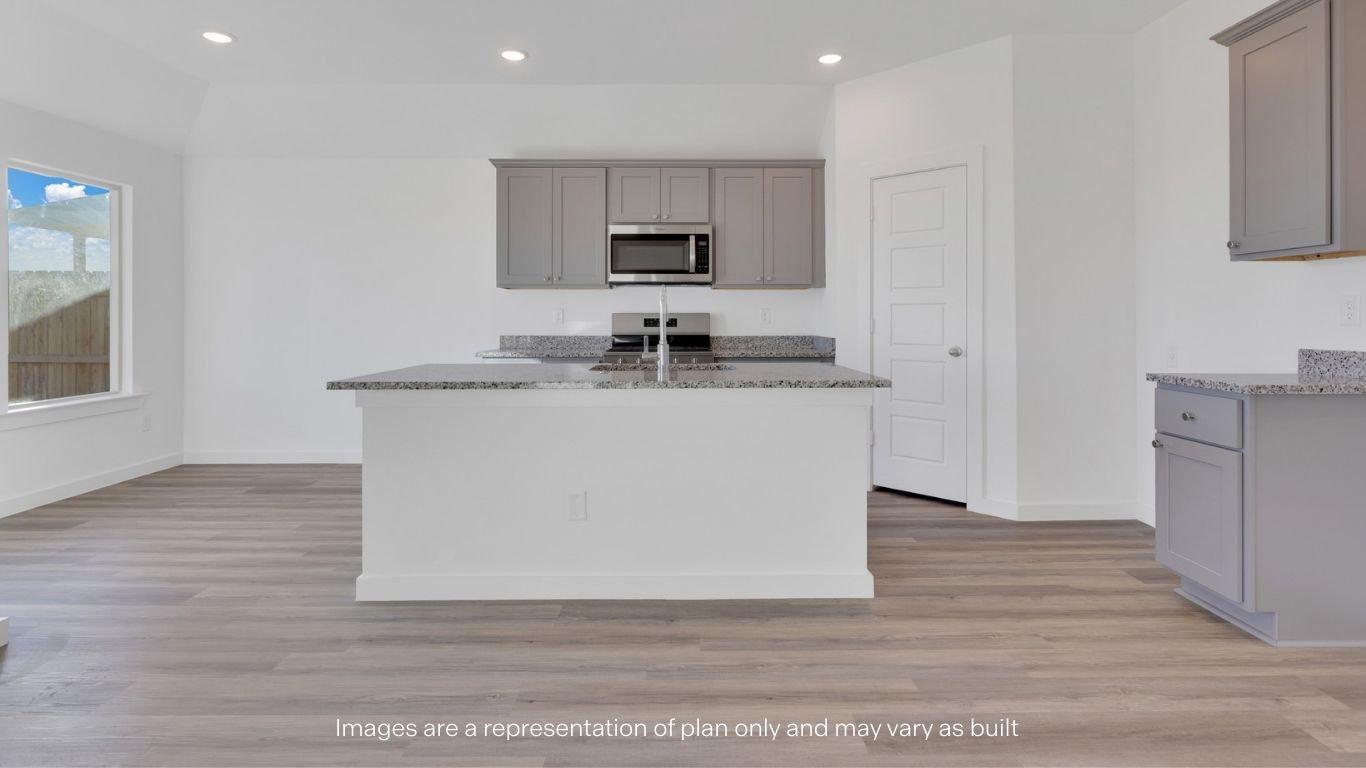 Spacious open concept kitchen with island and counter prep space