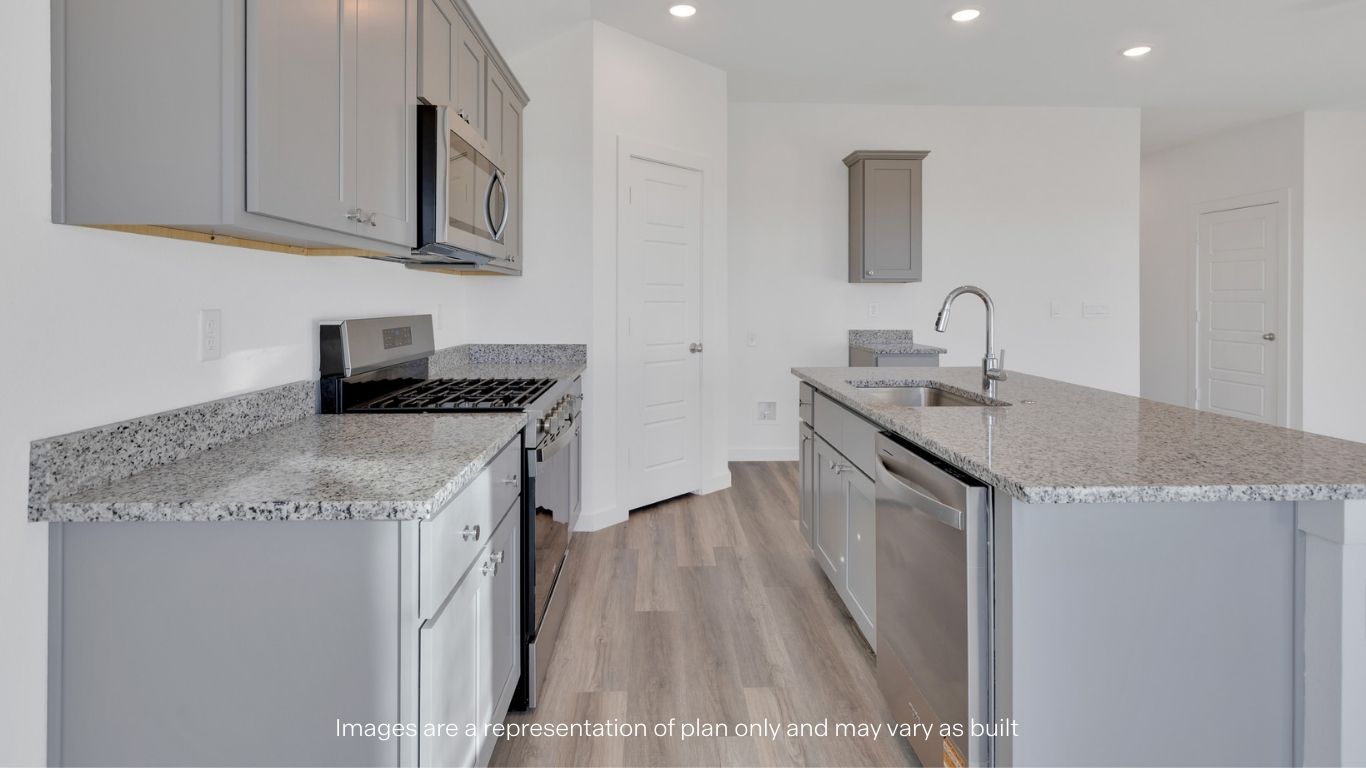 Open concept kitchen with stainless steel appliances, shaker style cabinets, and elevated finishes