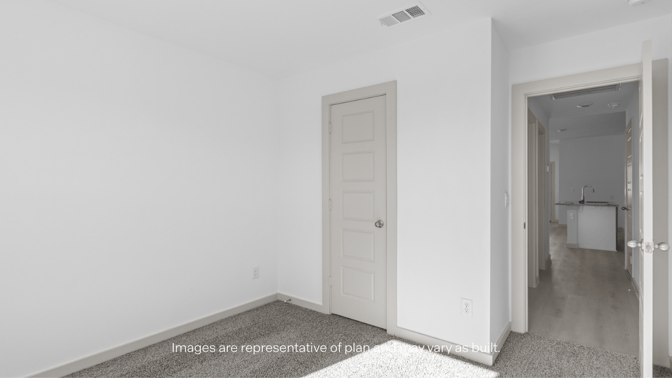 Guest bedroom 1 with front windows and ample natural light