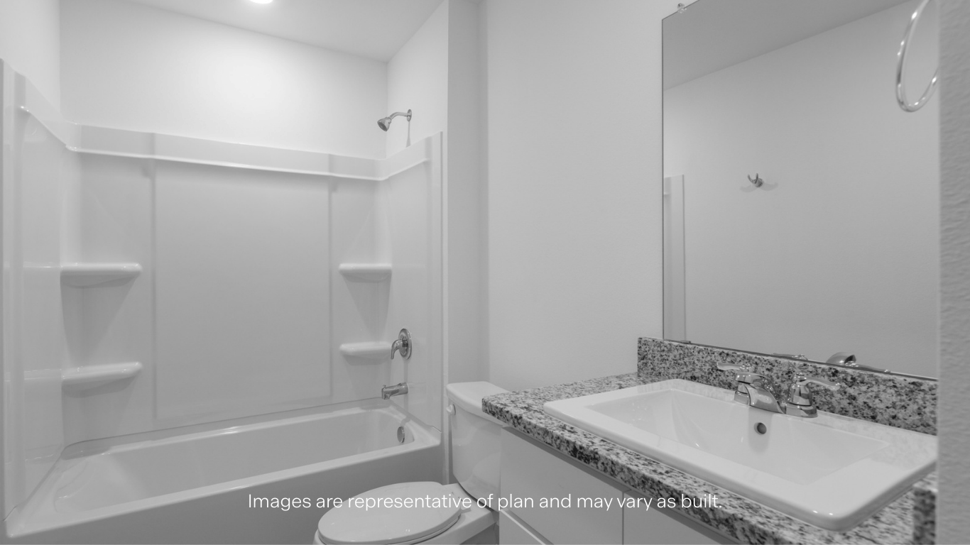 Guest bedroom 1 with front windows and ample natural light