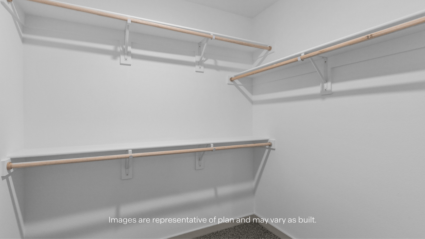 Primary walk-in closet with extra storage space