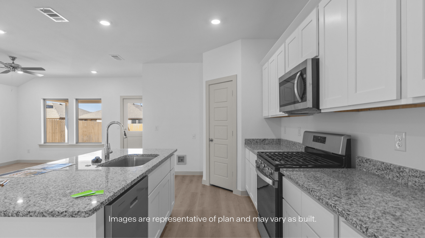 Open concept kitchen with stainless steel appliances, shaker style cabinets, and elevated finishes