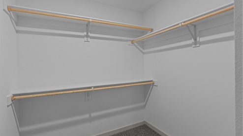 Large walk in closet with shelving