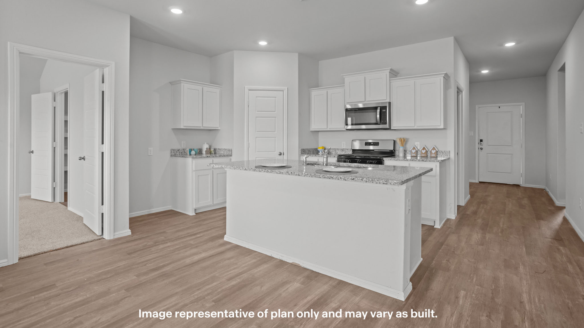 Spacious open concept kitchen with island and counter prep space