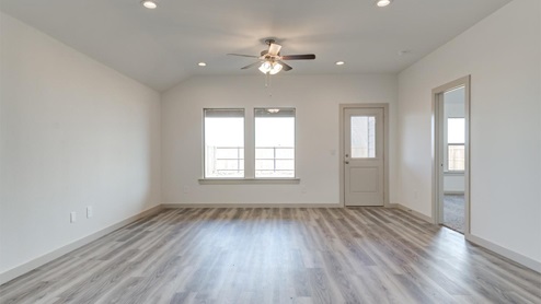 Large living area with door to back porch