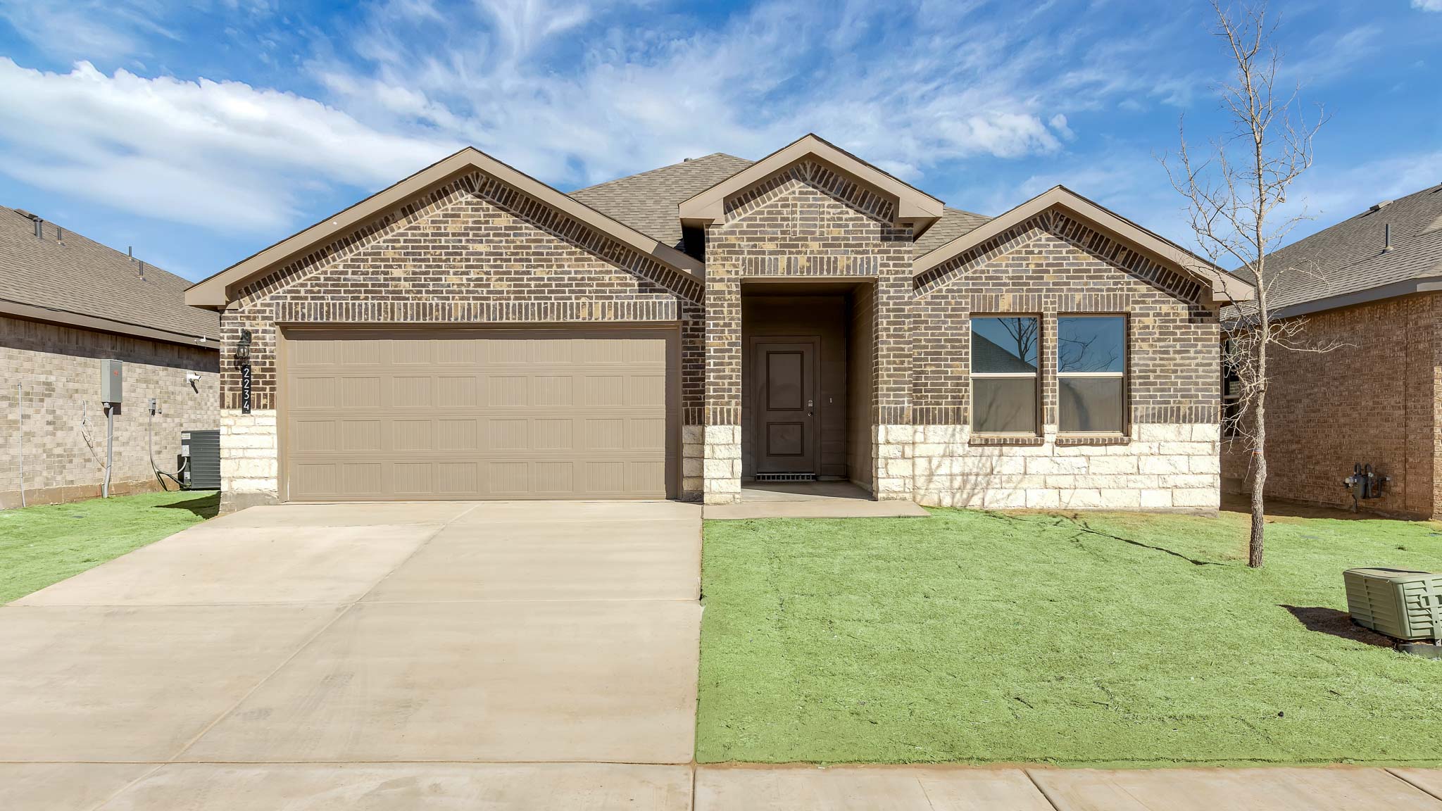 Exterior of single story modern brick style home