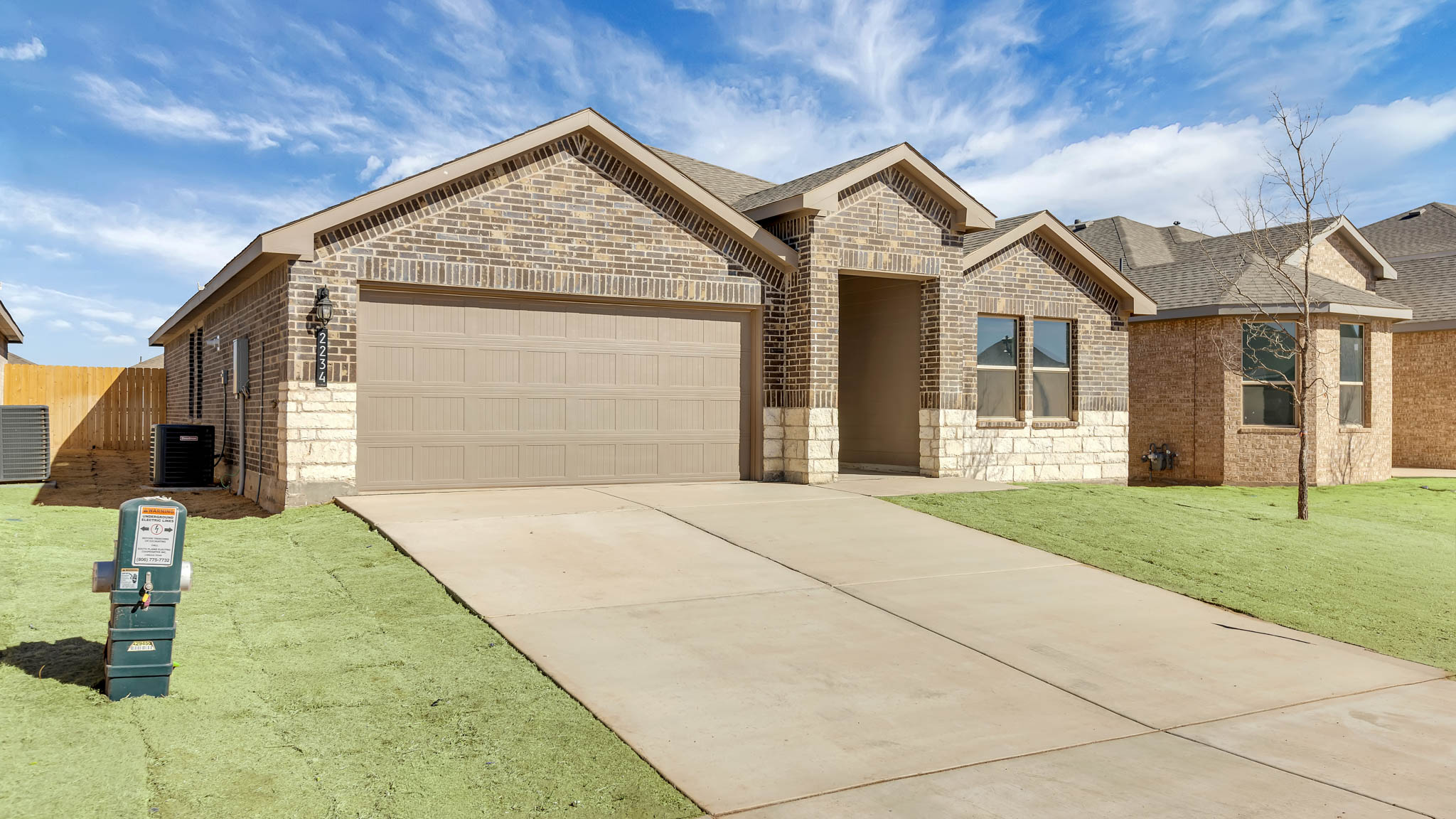 Side view of single story timeless brick home