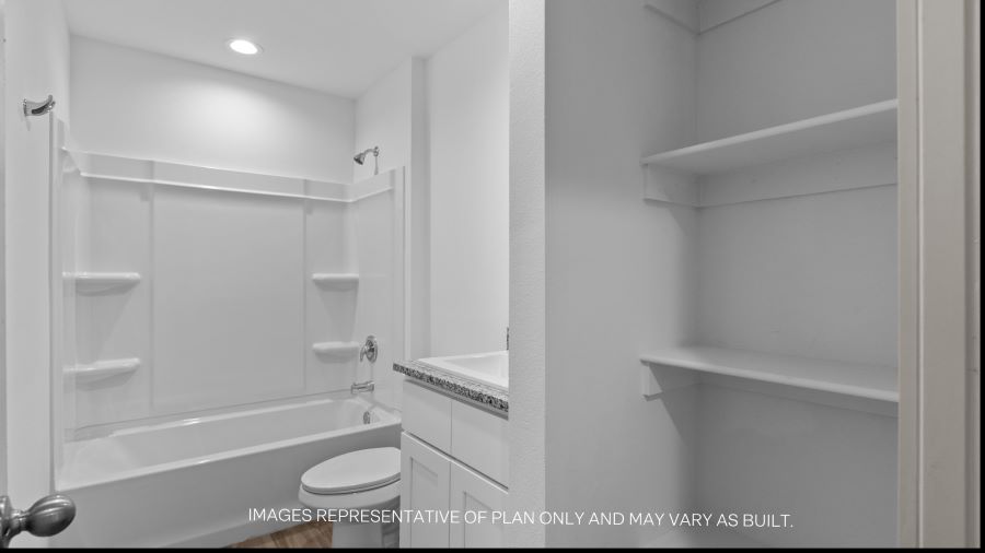 Guest bathroom with built in vanity and combination bathtub shower
