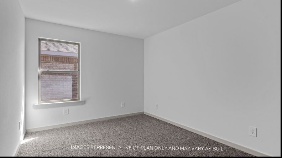 Guest bedroom 2 with side window and plush carpet floor