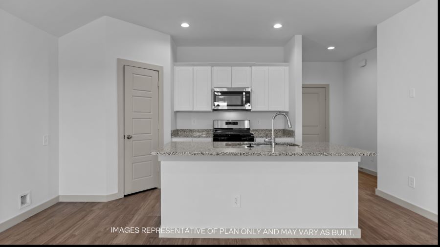 Spacious open concept kitchen with island and counter prep space