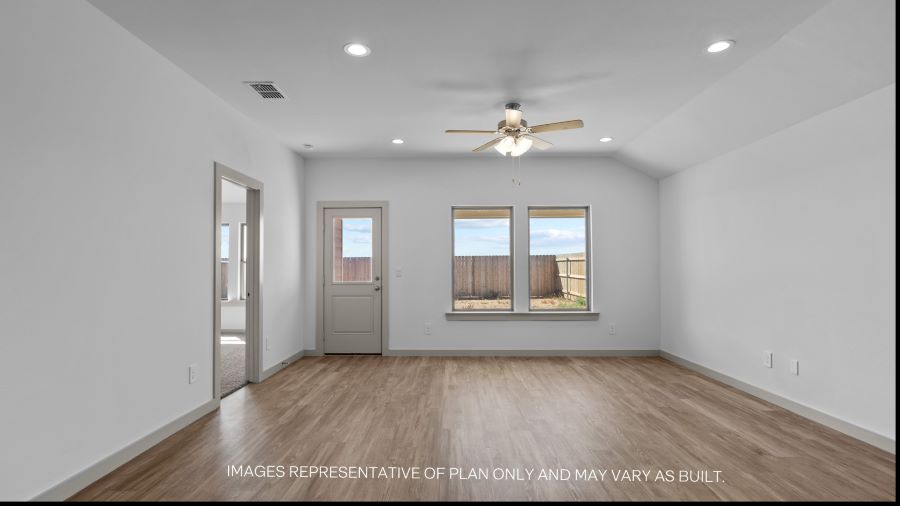 Spacious living and family room space with light allowing windows
