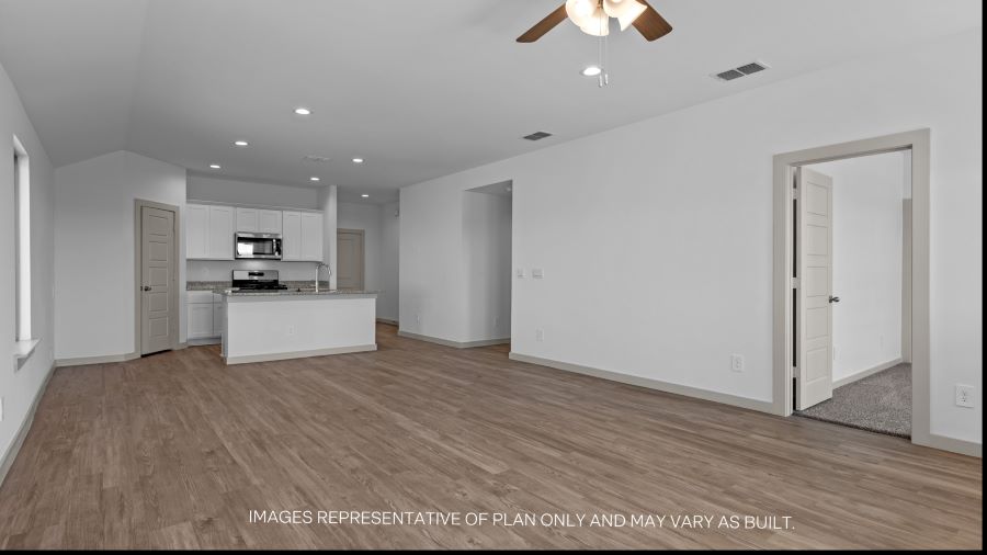 Open concept kitchen, living, family, and dining room space