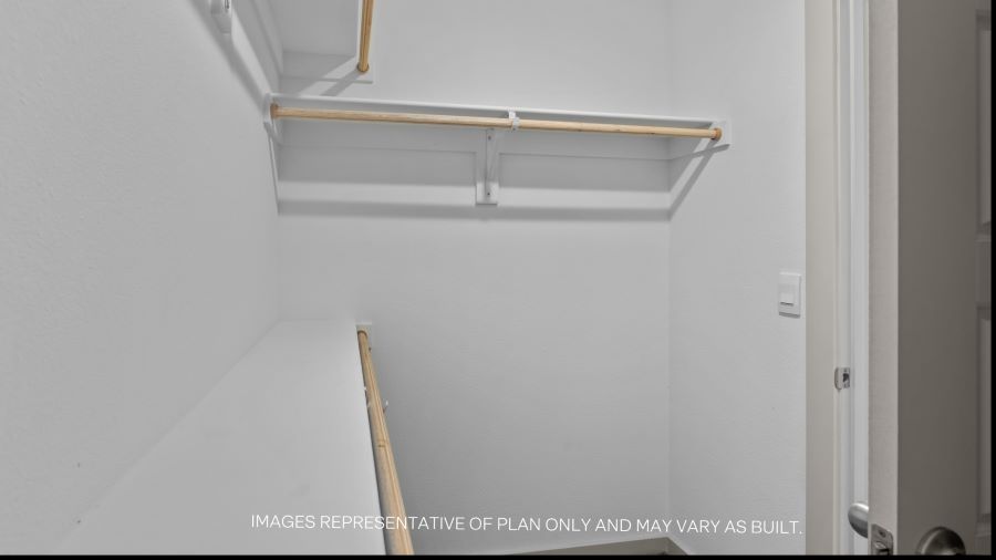 Primary walk-in closet with extra storage space