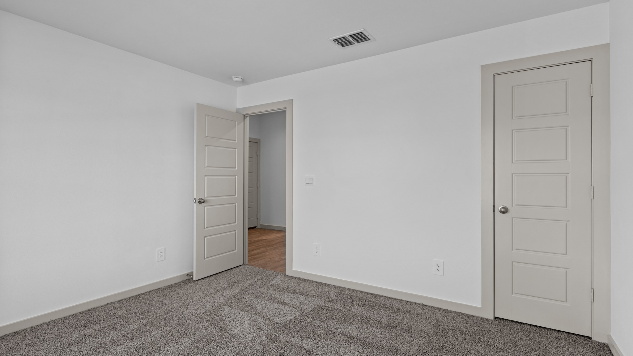 Primary bedroom with attached bathroom