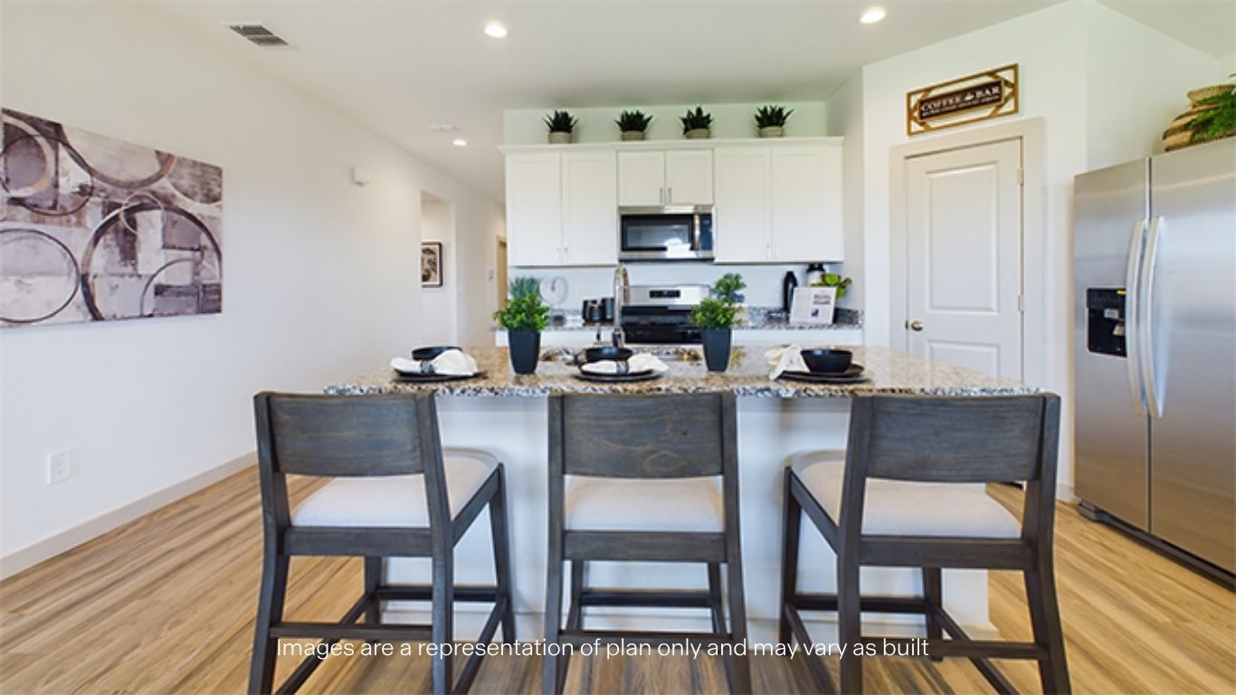Open concept kitchen with stainless steel appliances, shaker style cabinets, and elevated finishes