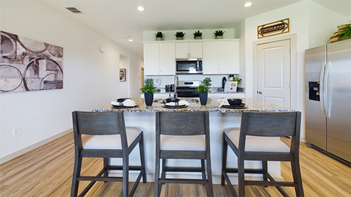 Kitchen with spacious island granite counter tops white cabinets