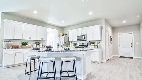 Kingston kitchen island with stools and white cabinets