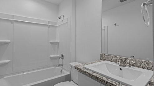 Guest bathroom conveniently situated by guest bedrooms