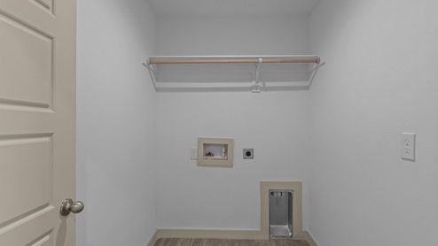 utility and laundry room with shelving